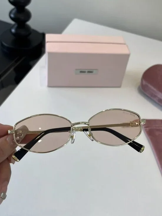 Miu Miu Cat-Eye Sunglasses with Gold Frames and Pink Lenses - Picture 2 of 7